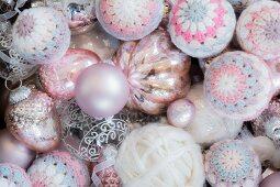 Christmas baubles and crocheted covers and made from pink mercury glass