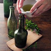 Spearmint wine à la Hildegard von Bingen being poured into bottles