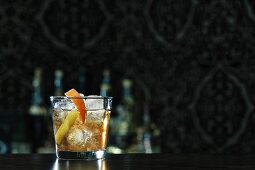 An Old Fashioned cocktail on a bar