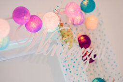 Ball fairy lights and decorative lettering