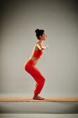 Sun salutation - Step 7: bend the knees, arms to the side