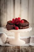 Gluten-free chocolate cake with raspberries