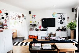 White cabinet elements next to open doorway in retro living room