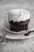 Chocolate cupcake with white frosting