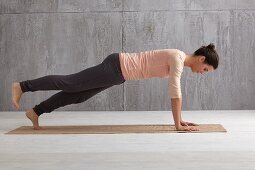 Downward dog into plank (yoga), step 2: plank, lift leg