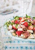 Salad with strawberries, ham, cheese and couscous