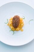 A baked chocolate egg on passion fruit and whiskey granita