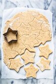 Pistachio star cookies being cut out