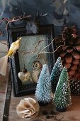 Festive still-life arrangement of Christmas-tree ornaments and picture frame