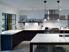 Fitted kitchen with marble worksurface and island counter