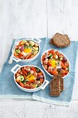Sausage and vegetable bake with egg served with wholemeal bread