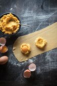 Ravioloni filled with vegetable cream and egg yolks being made