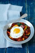 Fried chorizo with onions, peppers, courgettes and a fried egg