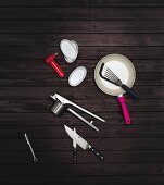 Various kitchen utensils on a black surface