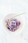 Purple potato salad with chive flowers