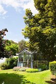 Greenhouse in a summer garden