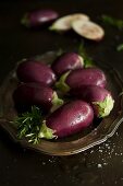 Baby aubergines on a silver tray