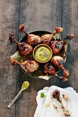 Barbecue chicken drumsticks with a dip