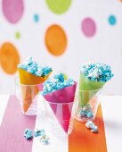 Blue popcorn in colourful paper bags