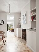 Fitted cupboards and shelving elements in living area