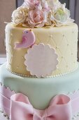 A festively decorated cake in delicate pastel tones