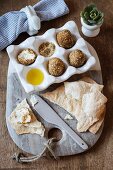 Labneh eggs in a dukkah coat (nut and spice mixture), with crispy flatbread