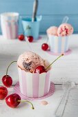 Cherry ice cream in paper tubs