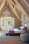 Rustic wooden roof structure in attic bedroom