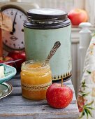 Apple, ginger and lemon jam in a glass jar