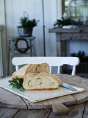 Yeast bread with rosemary on a rustic wooden table