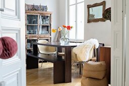 Dining table and vintage display case in dining area