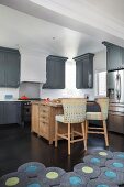 Wooden island counter in American-style kitchen