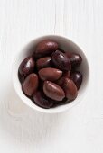 Kalamata olives in a white bowl