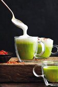 Pea cappuccino with Parmesan foam and bacon crumbs