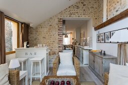Exposed masonry in open-plan living area of renovated townhouse