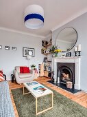 Open fireplace in eclectic living room