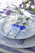 Laminated name tag with paper bellflower silhouette on plate