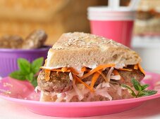 Mini burgers with coleslaw and a mint dip in unleavened bread