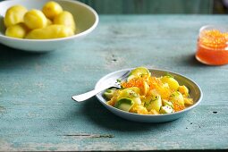 Potato salad with avocado and caviar