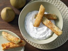 Kohlrabi sticks with a sesame seed coating and herb quark