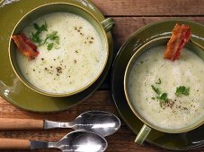 Potato and frisee lettuce soup with crispy bacon
