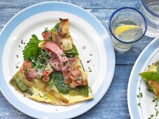 Potato omelette with ham and mange tout