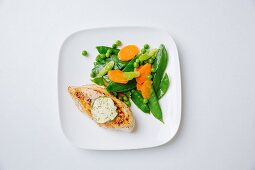 Chicken fillet with tarragon salt butter and spring vegetables
