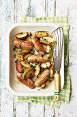 Oven-baked sausages with apples