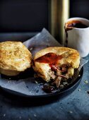 Lamb and anchovy pies with tomato sauce