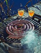 Wild boar sausages on a hot barbecue