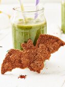 A cinnamon bat biscuit and a green smoothie for Halloween