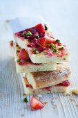 Sweet brioche pizza with strawberries and pistachios
