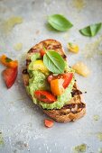 Bruschetta with avocado and colourful tomatoes