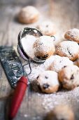 Christmas pastries with currants and icing sugar